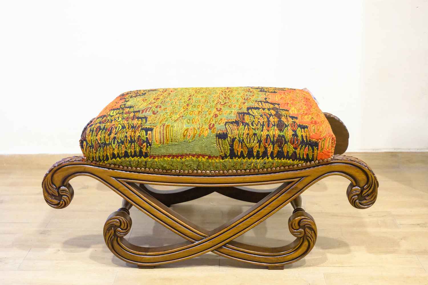 UPHOLSTERED HAND CARVED BLOCH OTTOMAN (NTAMC)