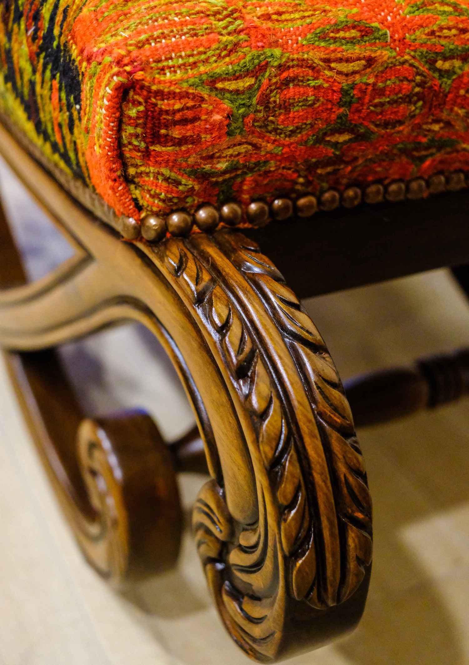 UPHOLSTERED HAND CARVED BLOCH OTTOMAN (NTAMC)