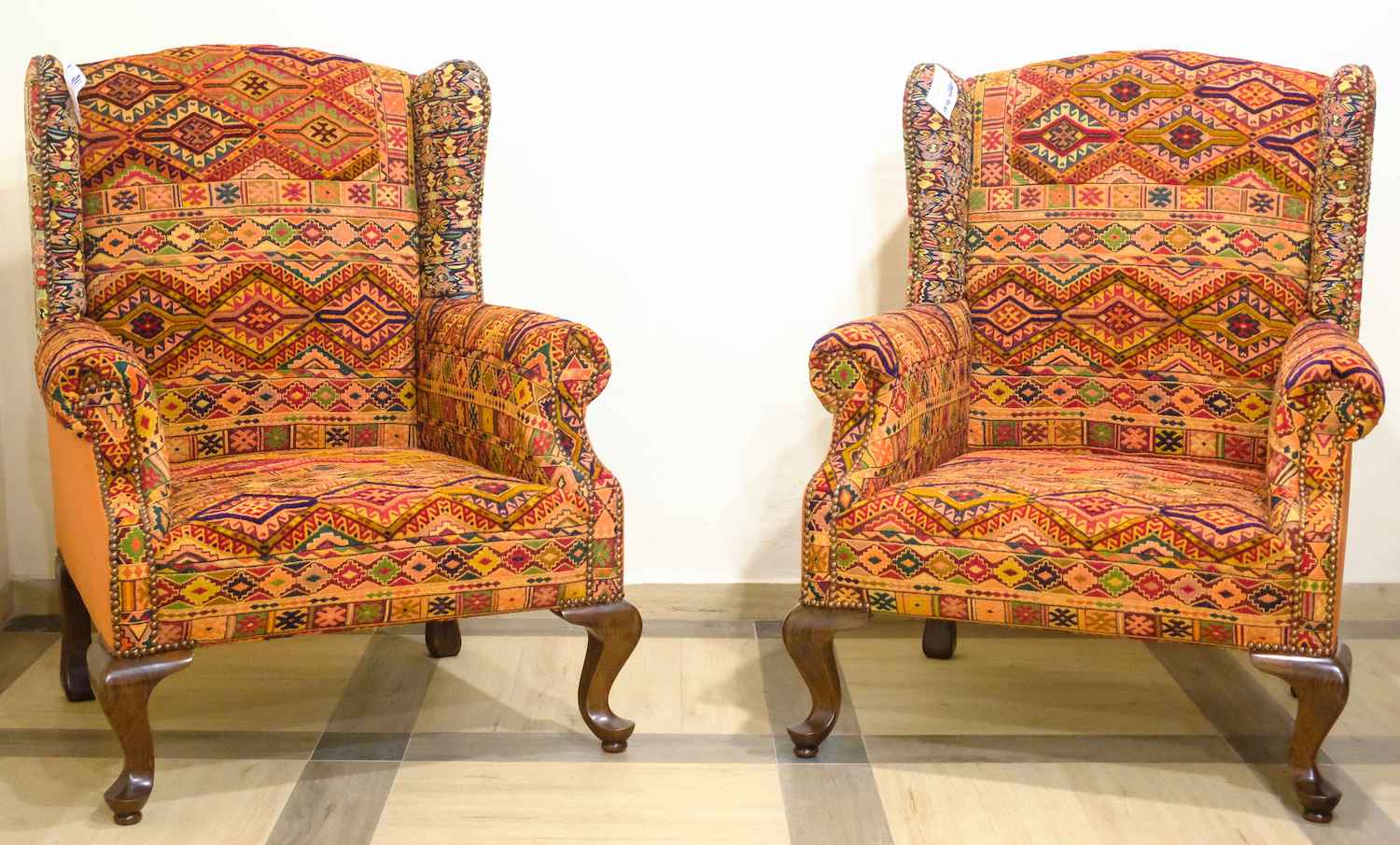 UPHOLSTERED HAND CARVED WING CHARE (NTAMD)