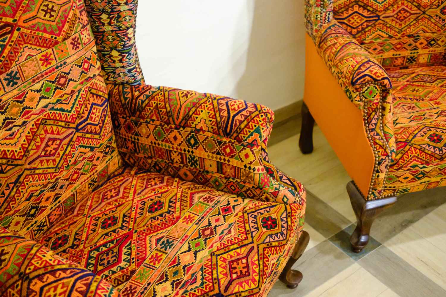UPHOLSTERED HAND CARVED WING CHARE (NTAMD)